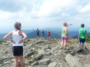 Teens on mountain summit