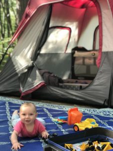 baby in front of tent