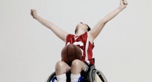 kid playing wheelchair basketball - ways to support the differently abled community on the Seacoast