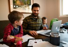 father at table with computer and two young sons - local resources for homeschooling in New Hampshire
