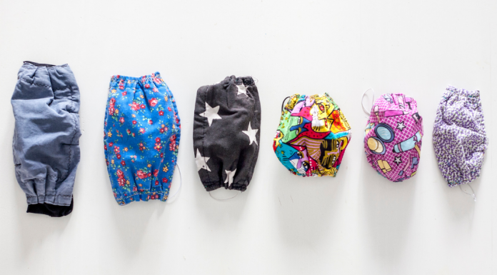lineup of masks from big to small -- preparing kids to go out during a pandemic