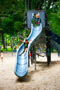 child on slide at playground
