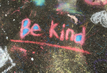 Chalk drawing on a sidewalk with the words Be Kind. November 13 is World Kindness Day
