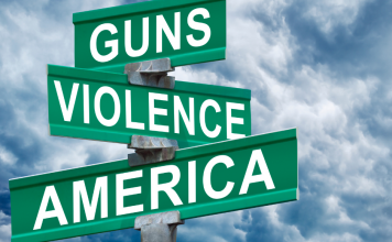 street signs with Guns, Violence and America on them