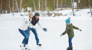 Parents ice skating with child