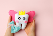 tooth fairy pillow in a childs hands