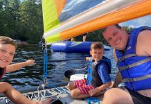 two boys and a dad sailing